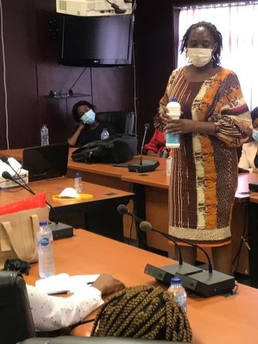 a woman in a mask mask and a mask on a table