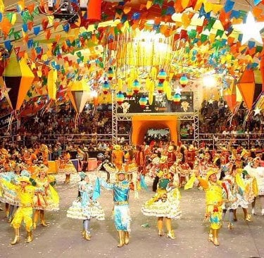 a group of people in colorful costumes and costumes