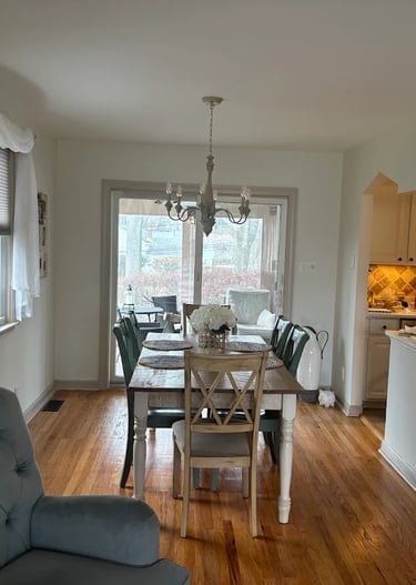 a dining room with a table and chairs