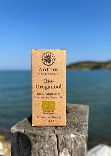 a box of organic oregano essential oil on a wooden post
