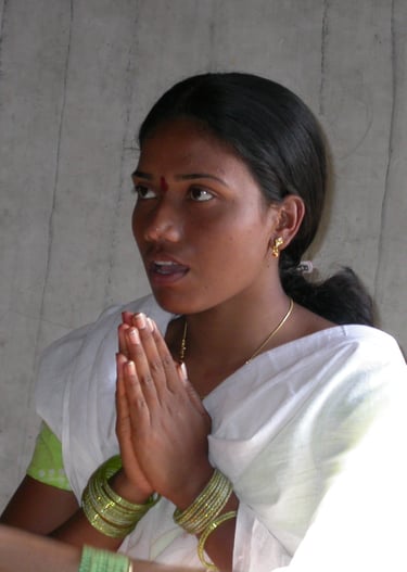 hindu girl praying in temple