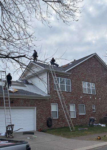 Roofers Replacing a Roof Damaged by Hail in Franklin TN
