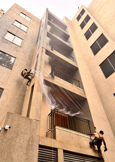 residential balcony fully covered with a durable pigeon net in an urban setting.
