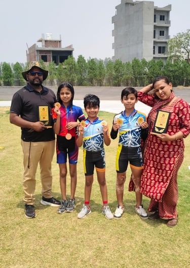 Young athletes proudly display gold medals and trophies with their coaches after a roller skating competition.