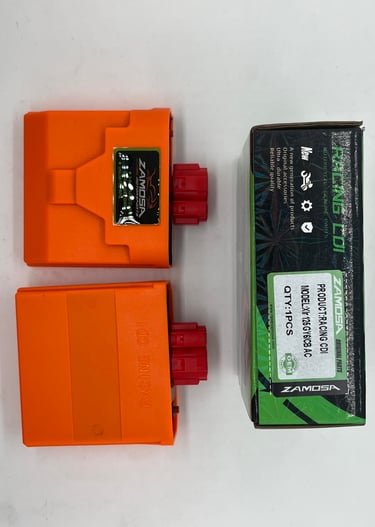 a couple of orange batteries in a box