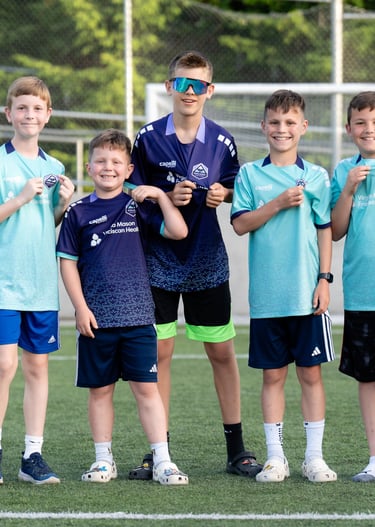 Boys wearing Midlakes jerseys and highlighting the Midlakes United  crest.