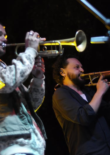 a man playing a trumpet in a band