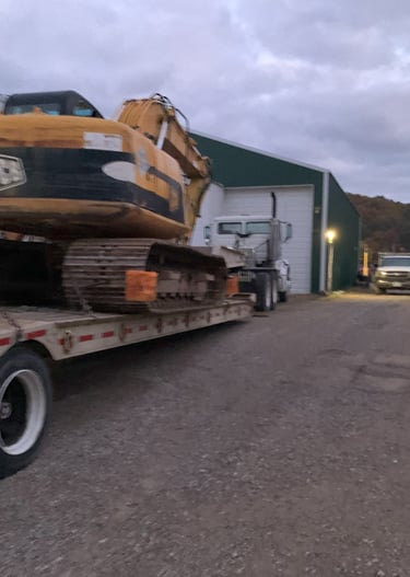 jcb track hoe going to job