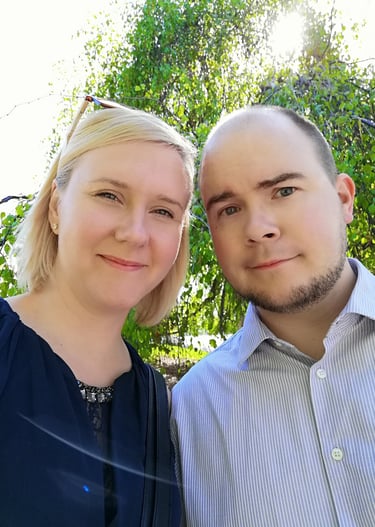a man and woman standing next to each other
