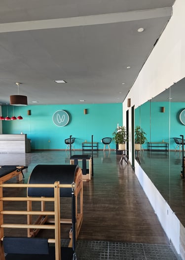 a room with a table and chairs and a clock