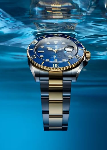 Rolex Submariner with a blue dial and gold accents, showcasing luxury and precision.