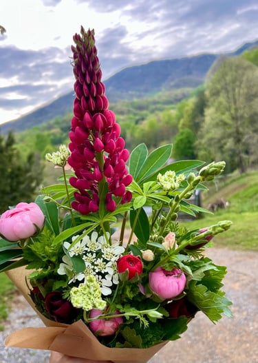 Vibrant red column delicate petaled flower in an arrange bouquet