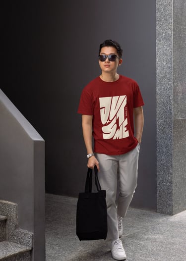 a man in a red shirt and sunglasses walking down stairs