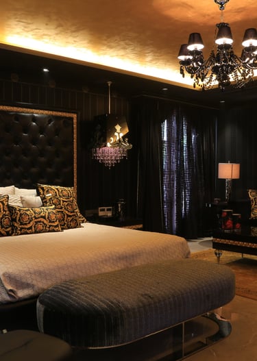 a bedroom with a bed and a couch