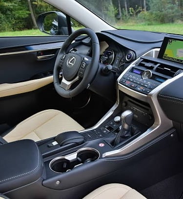 a car dashboard with a steering wheel and dashboard