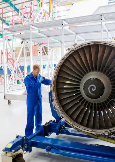 an aerospace engine inspection being taken place by an engineer with a borescope