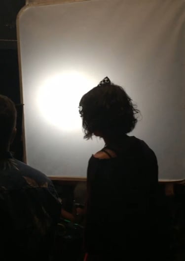 Actress Starlise Waschuk silhouetted on the set of Fatal Rhapsody