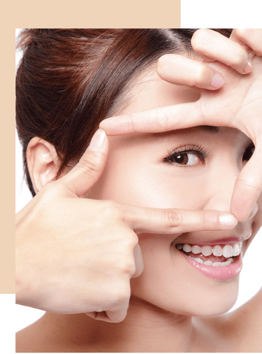 a woman with a smile on her face and hands on her face