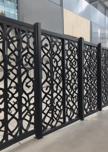 A skilled technician bending metal sheets into decorative shapes with a ubkant machine.