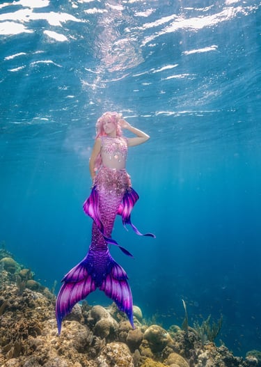 Mermaid Pixi free dives as a mermaid in Roatan Honduras