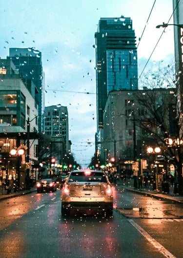 Rainy Seattle street with glistening wet pavement and iconic city charm.