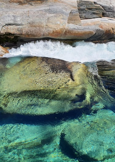 a large rock formation in the water