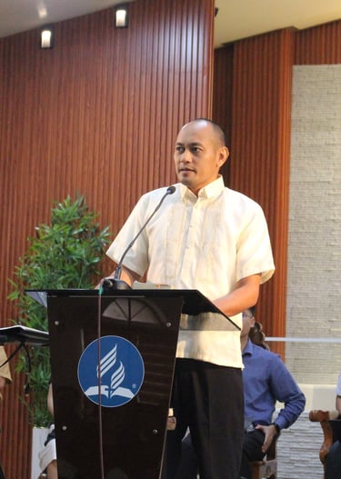 Man speaking on a podium
