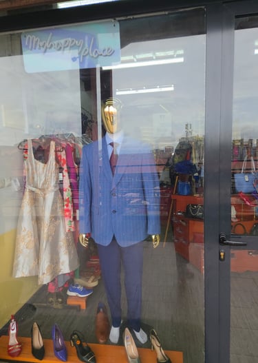 a mannequine of a suit and shoes