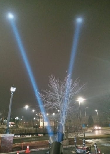 5k searchlights hitting fog in sky