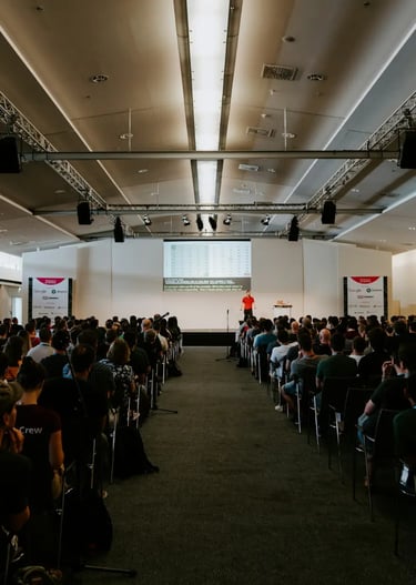 Speaker presenting ideas to a small attentive audience in a cozy space