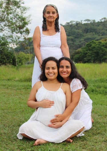 Grandmother Raquel holding the head of her Daughter and Granddaughter.