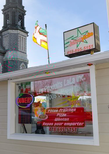 a restaurant with a clock tower in the background