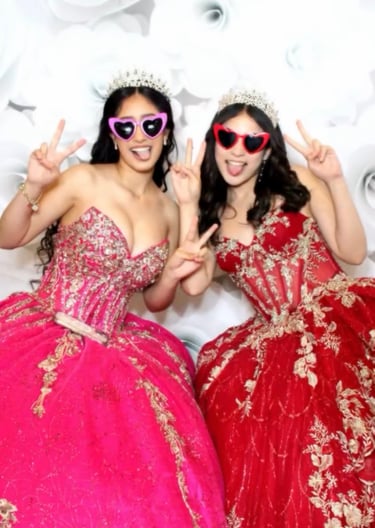 Girls in quince gowns in glam photo with heart glasses, tiara's at a Quinceañera Mirror Photo Booth.