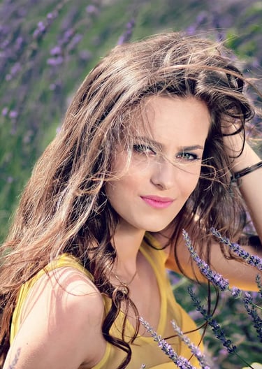Profile of a woman with long, flowing hair, symbolizing natural beauty and vitality.