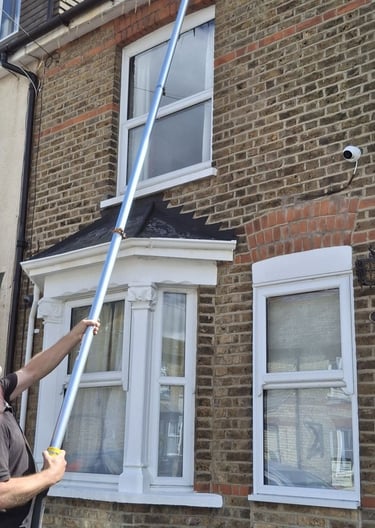 Gutter vacuum cleaning system in use in Hoddesdon