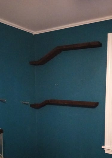 2 floating shelves installed, steel posts ready for another to be mounted