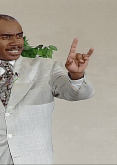 Gino Jennings of Truth of God Broadcast showing hand signs at the FCOOLJC on July 29 2020