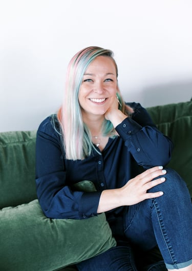 Tabitha with butterfly effect consulting on a couch