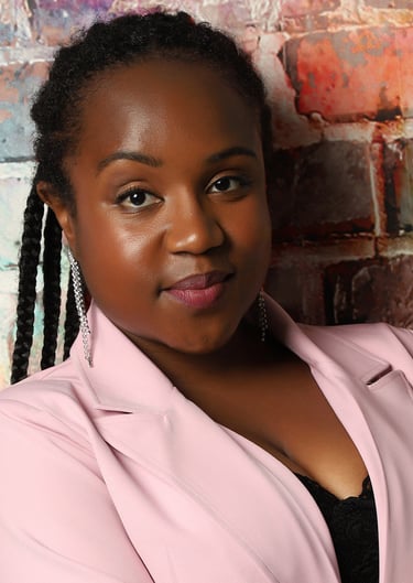 a Black woman with a pink jacket and black top