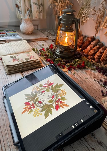 Creative desk of illustrator Ildiko Hankoszky with iPad, paints, and Blooming Lantern decor