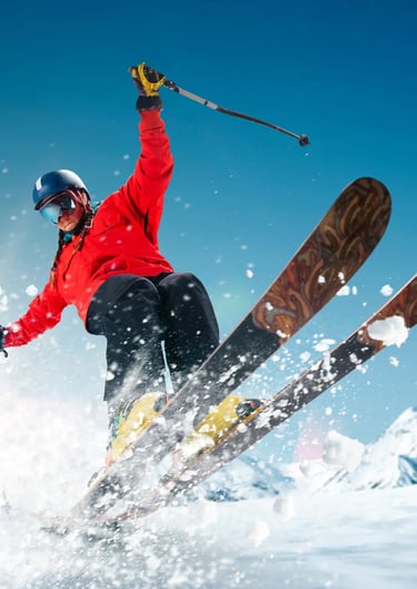 Skier carving through fresh powder snow, dynamic winter action shot in the French Alps.