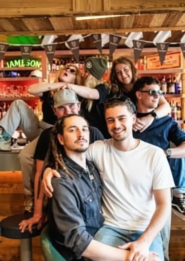 Friends enjoying drinks and socializing at the Funky Fox mountain bar.