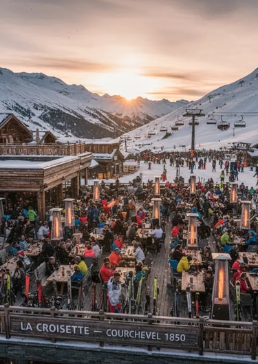 La Croisette Courchevel 1850 outdoor dining area during winter sunset.