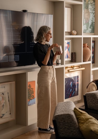 woman standing and holding a box