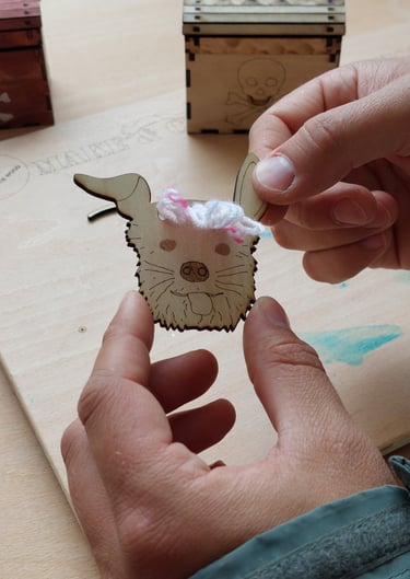 Hands holding a wooden dog's head