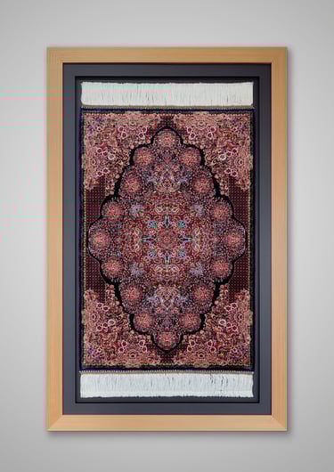 An oriental carpet framed in a natural wooden frame and set against a black border and backing.