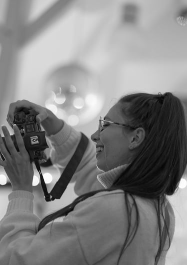 a woman taking a picture of herself taking a picture of herself