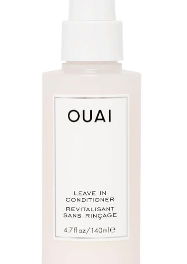 OUAI Leave In Conditioner spray bottle for hair hydration and heat protection.