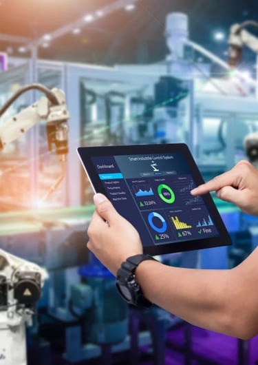 controls technician holding a tablet computer and a tablet with a robot