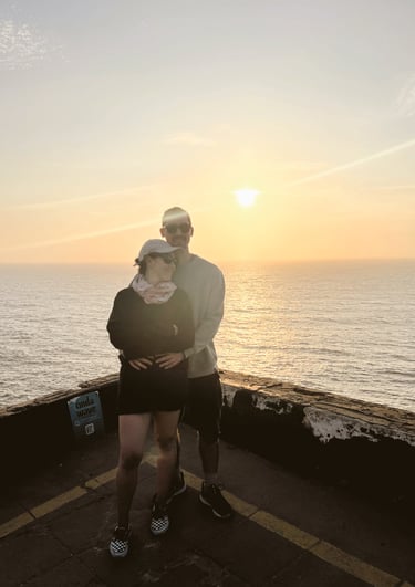 a man and woman standing on a pier